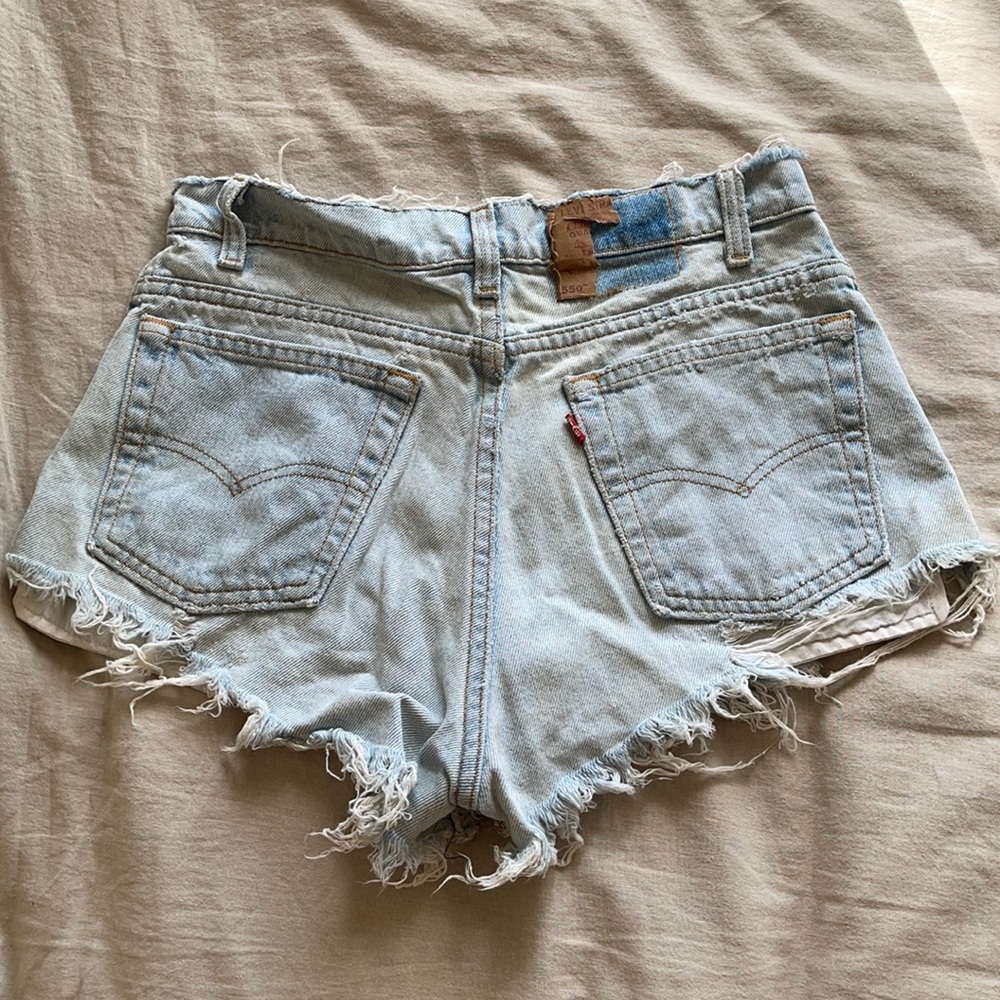 Super distressed vintage Levi’s 550 shorts